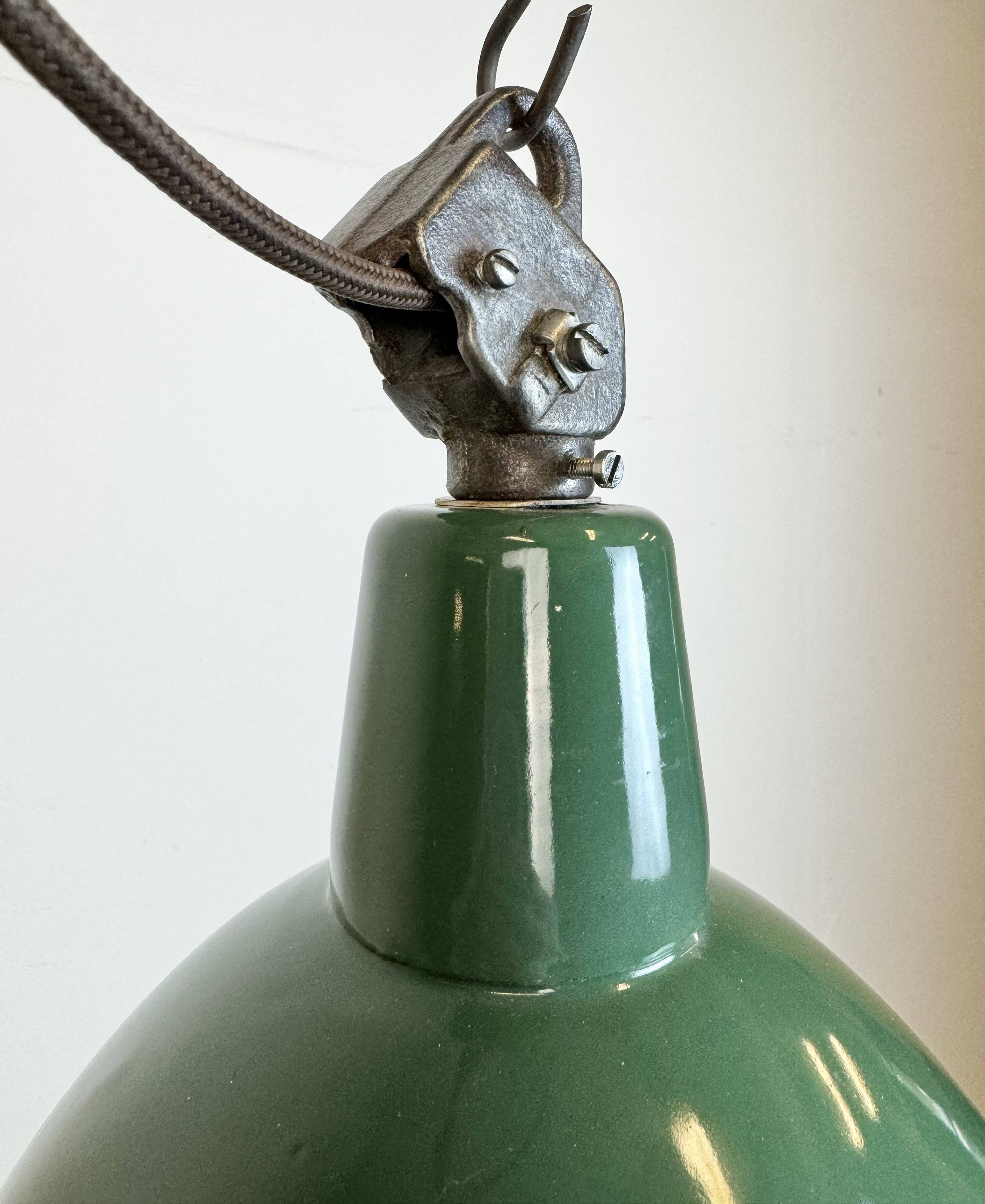 Industrial green enamel factory lamp with cast iron top, 1960s