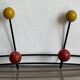 Iron wall coat rack and wooden hooks from the 60s