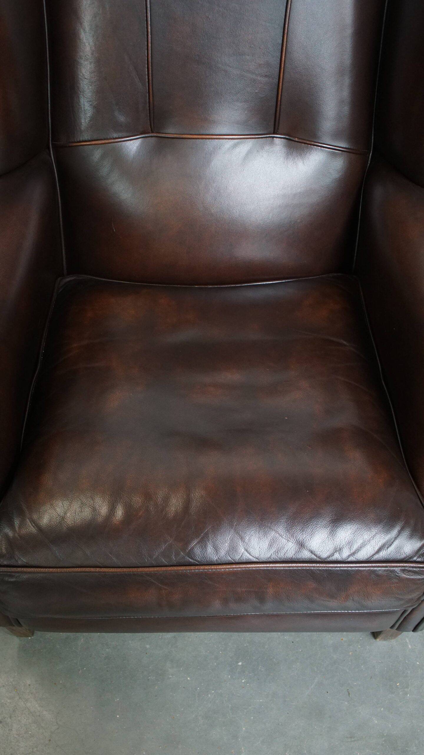 Comfortable and very beautiful set of 2 cow leather wingback armchairs in English style