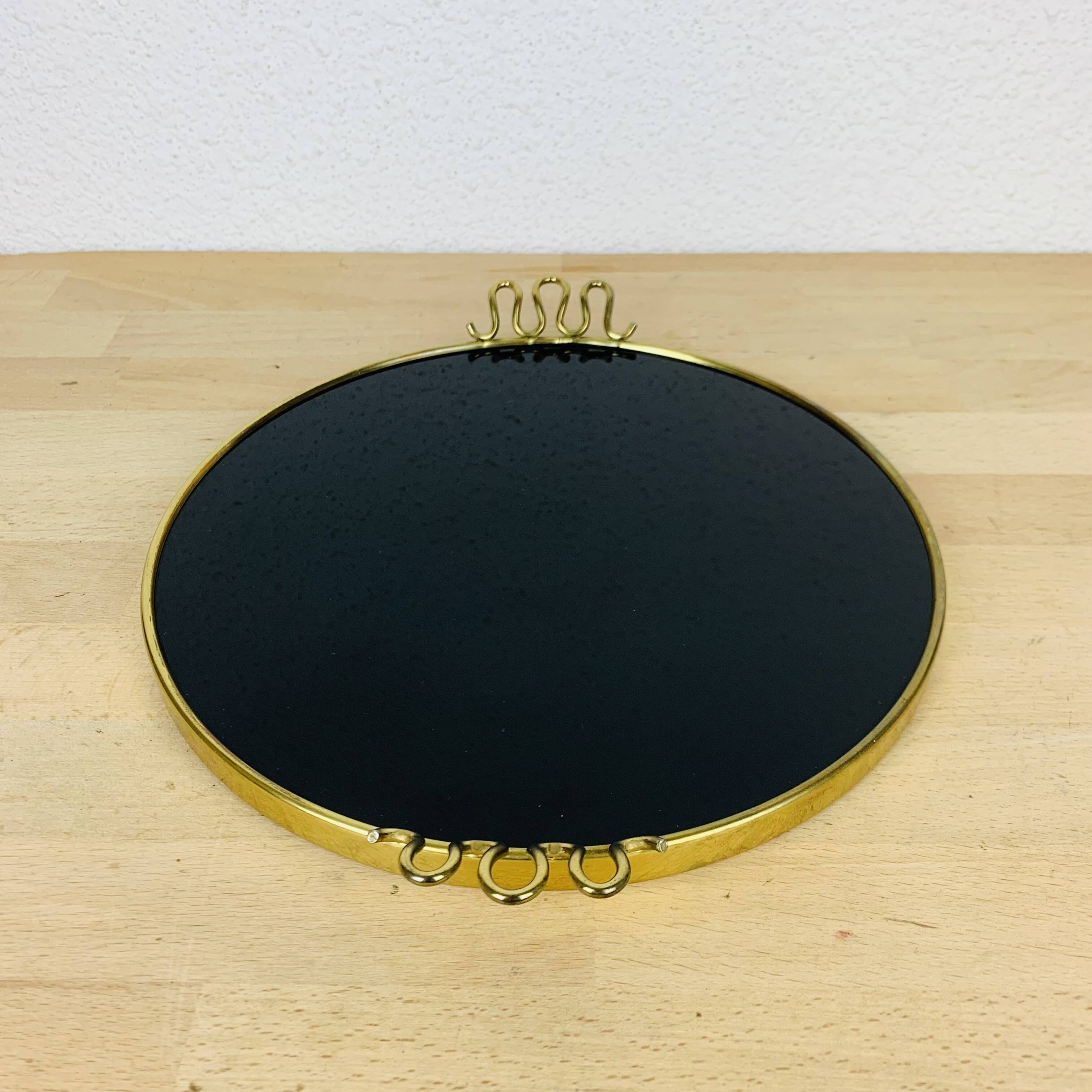 Black and golden brass tray from the 1950s
