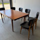Rectangular extendable table in Scandinavian design made of solid teak.