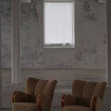 Pair of Danish Art Deco modern lounge chairs in sheepskin with lambswool and elm, 1940s.