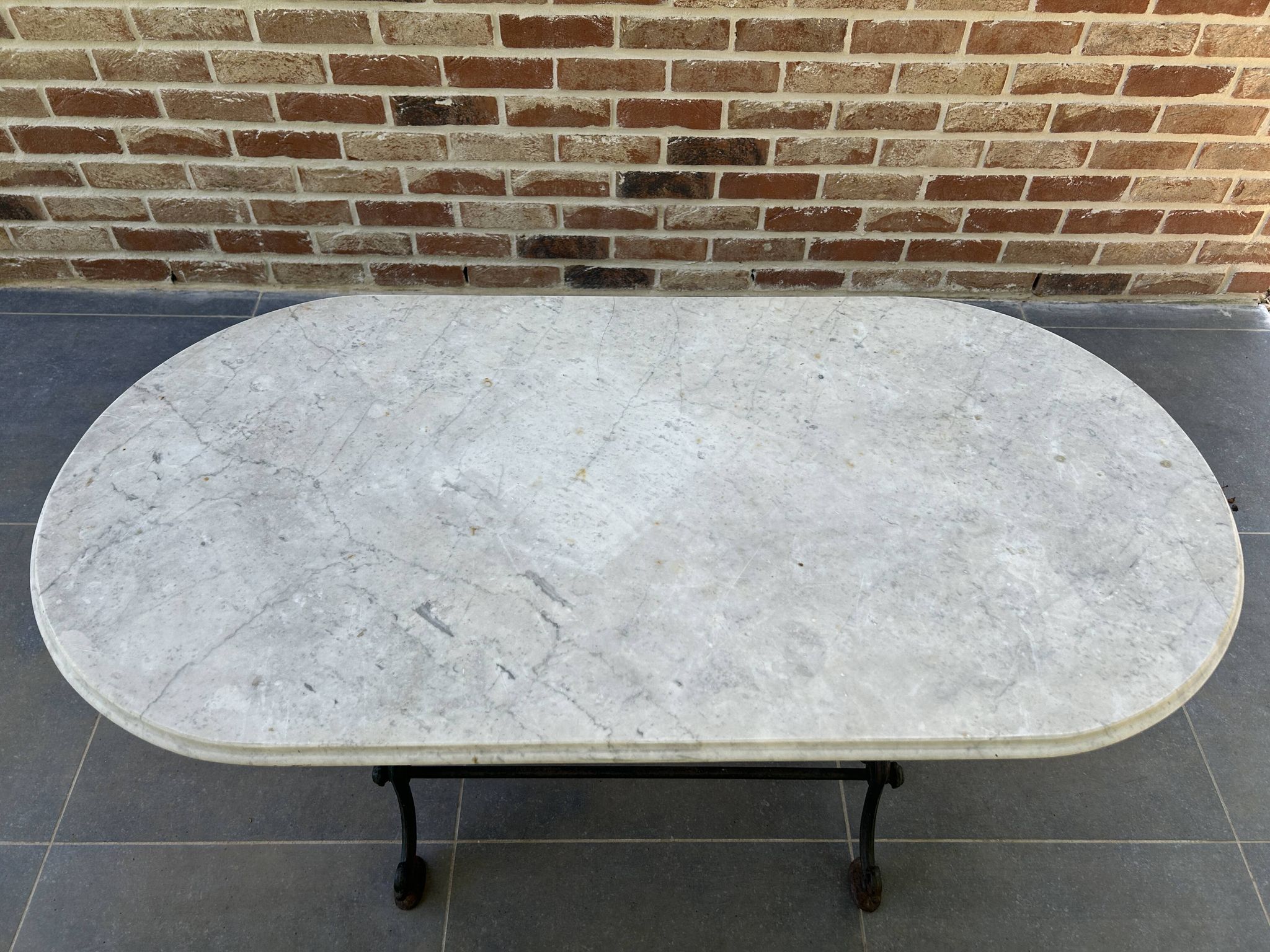 Art Nouveau cast iron and marble bistro table.