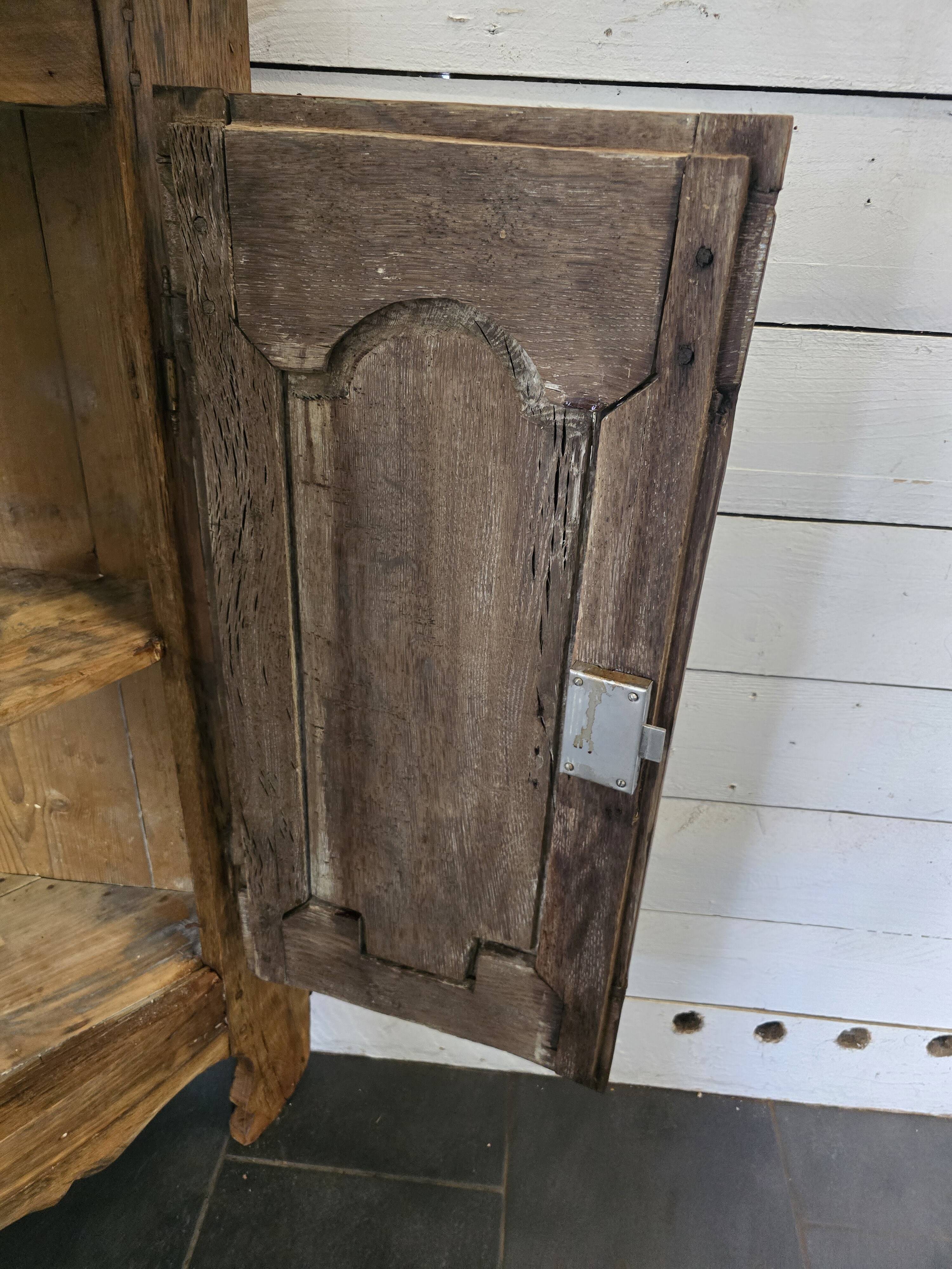 19th century curved corner cupboard in oak