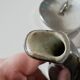 vintage teapot covered with silver metal