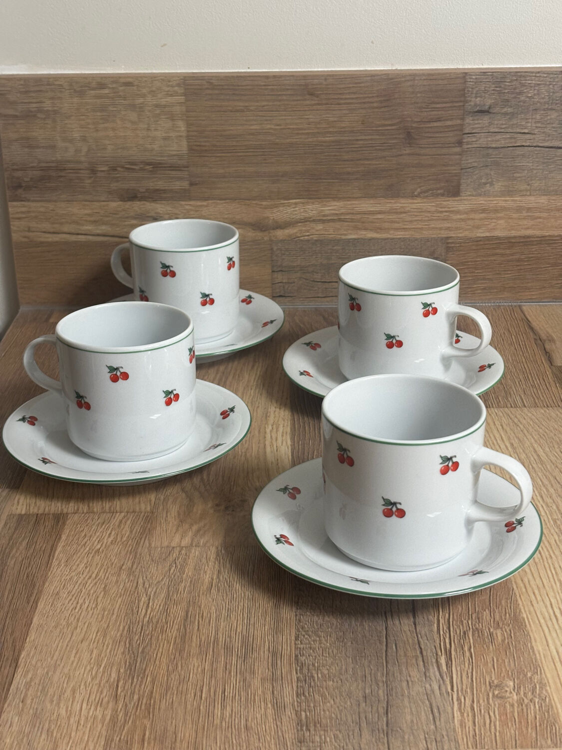 Set of 4 large cherry porcelain cups and saucers.