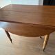 Round mahogany folding and extendable table