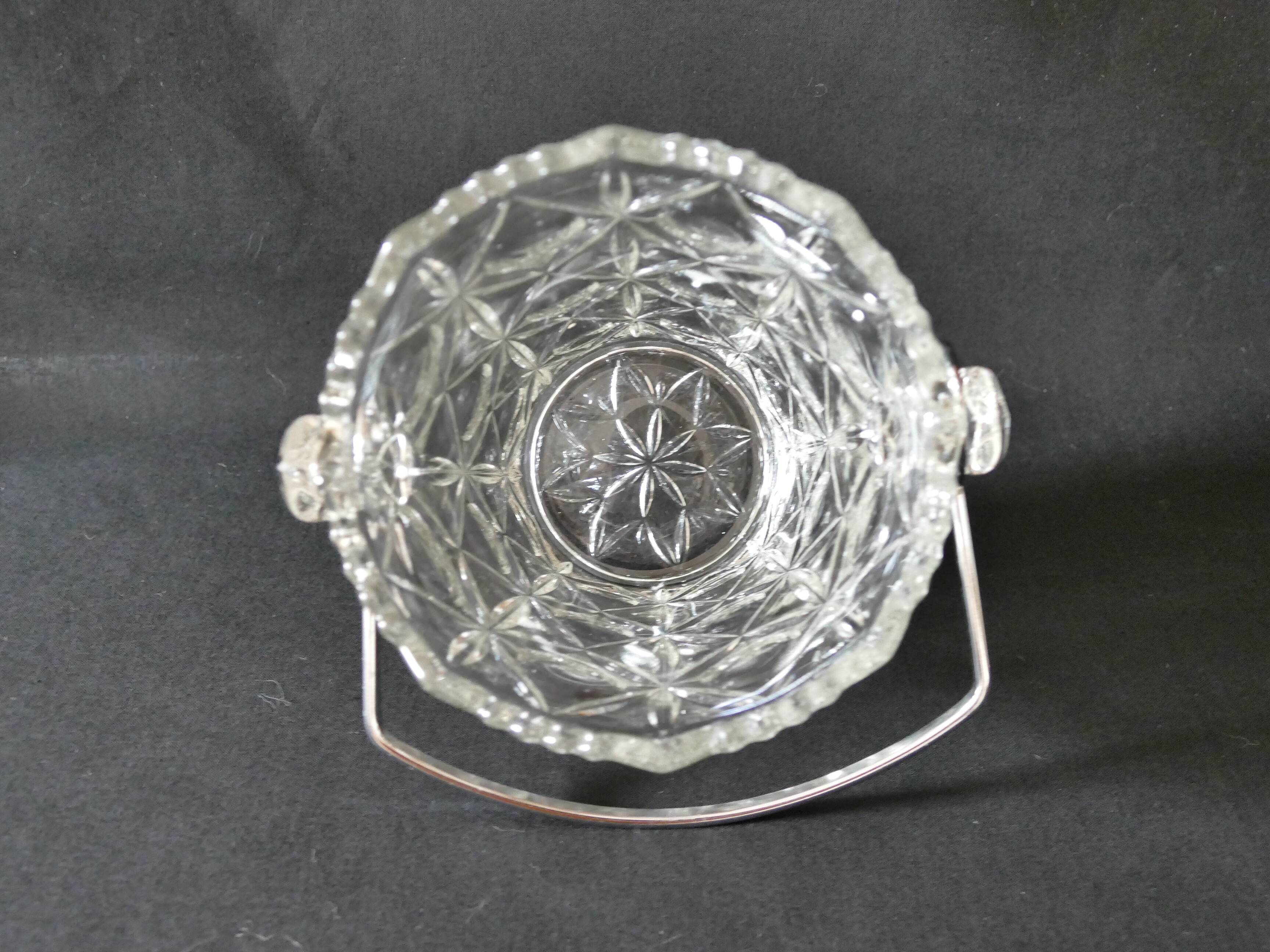 Vintage glass ice bucket stamped with a metal handle