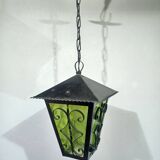 Wrought iron and green glass lantern
