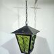 Wrought iron and green glass lantern