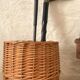 Woven wicker basket, vintage rod holder