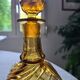 Antique decanter made of amber blown glass