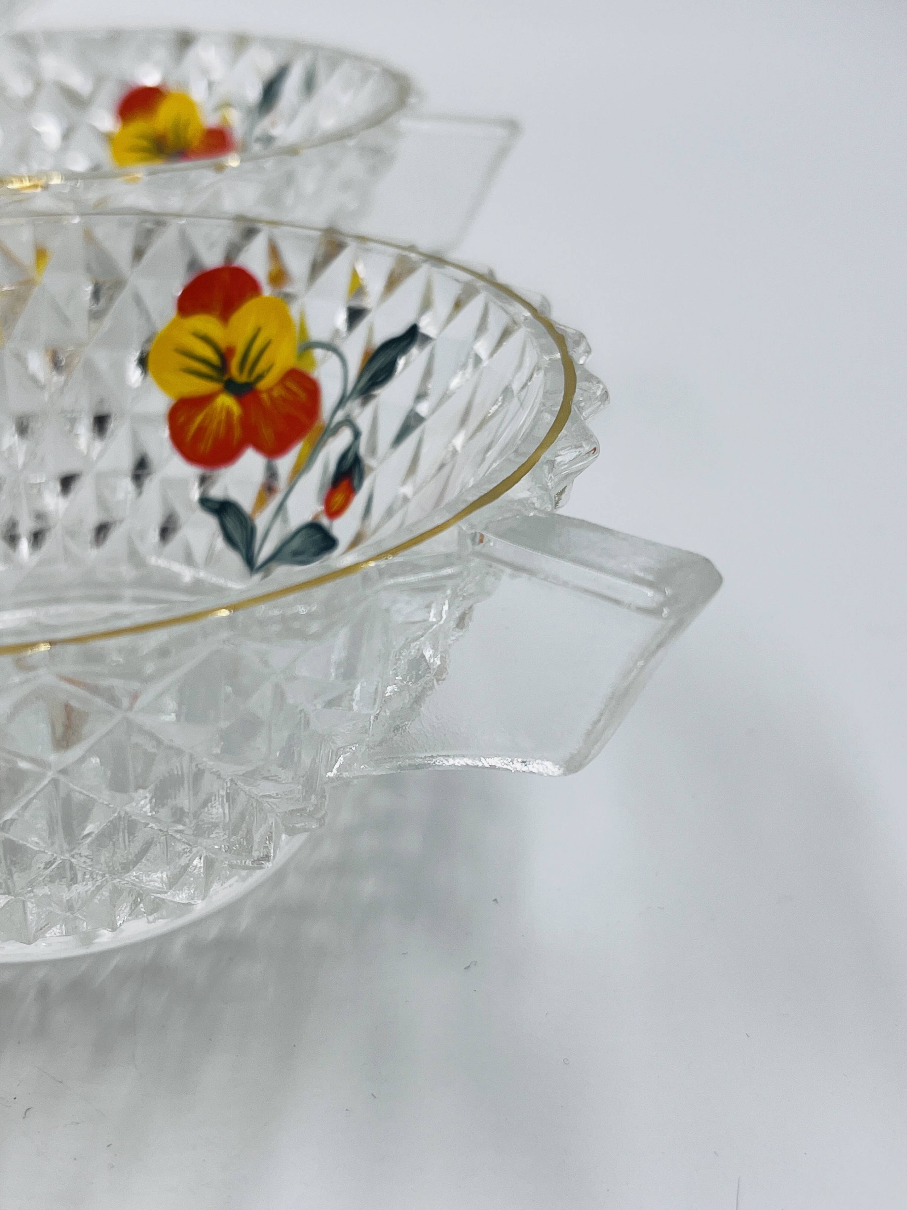 Vintage glass fruit salad serving set with a pansy design.