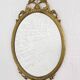 Miroir ovale ancien type médaillon sur cadre laiton