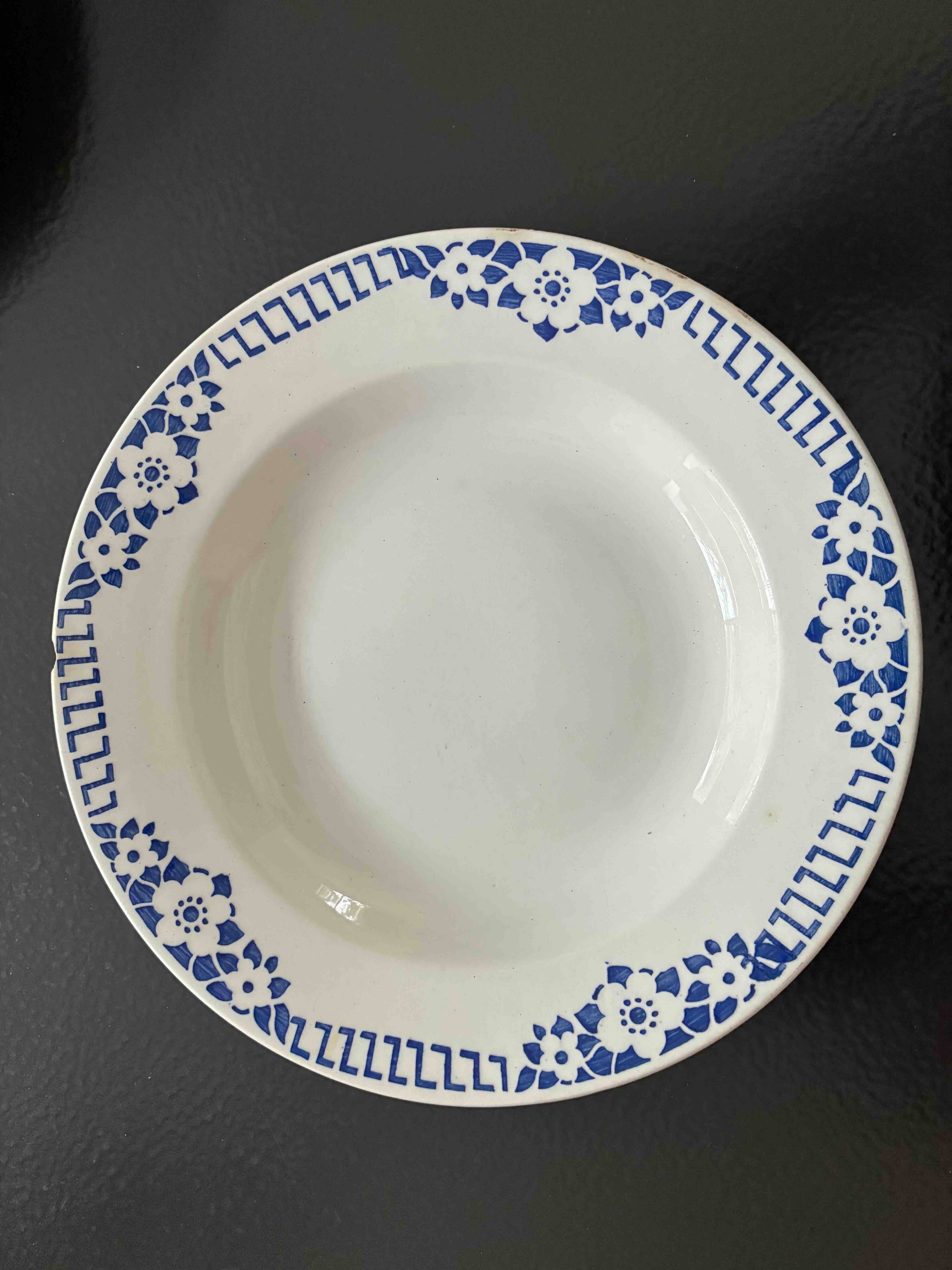 Set of 9 vintage deep plates with blue patterns.