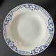 Set of 9 vintage deep plates with blue patterns.