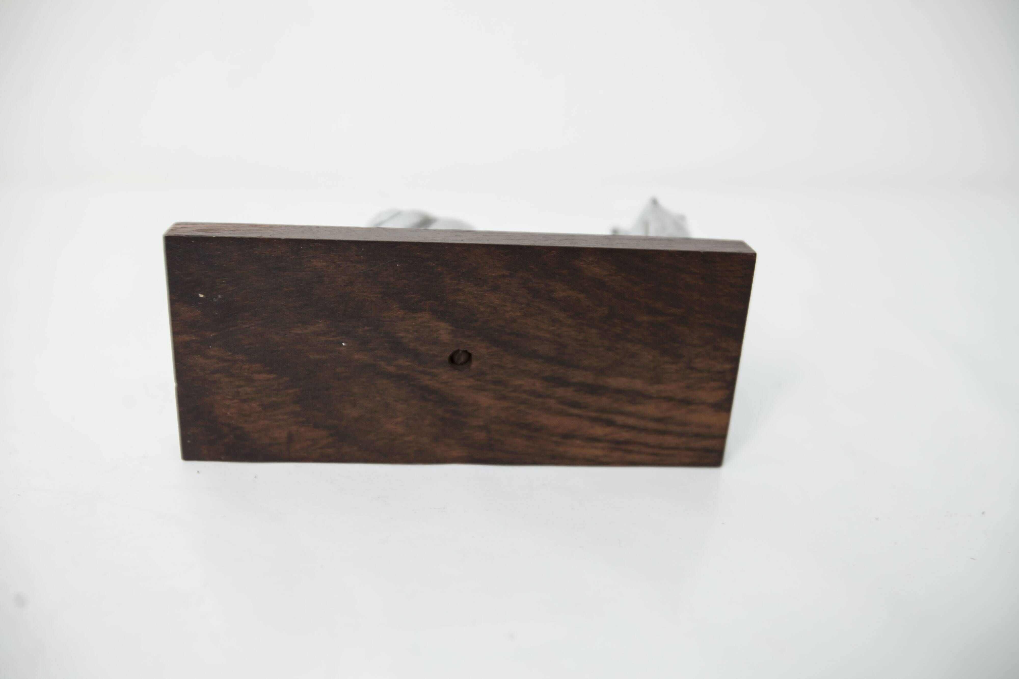 Silver snail candlestick on a teak base 1960