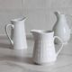 3 old French pitchers in white ceramic