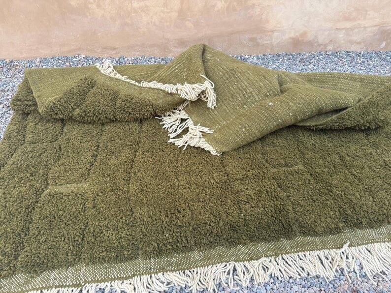 Handmade traditional pure wool rug in green, size 150 x 250 cm.