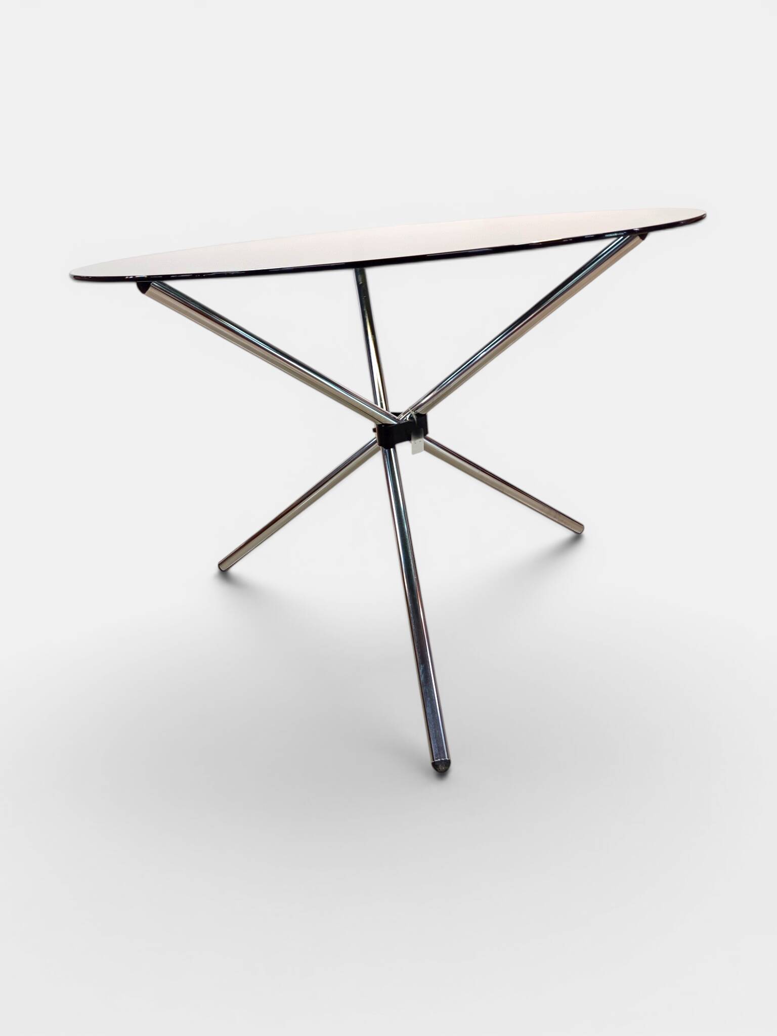 Vintage round table with smoked glass and foldable chrome legs.