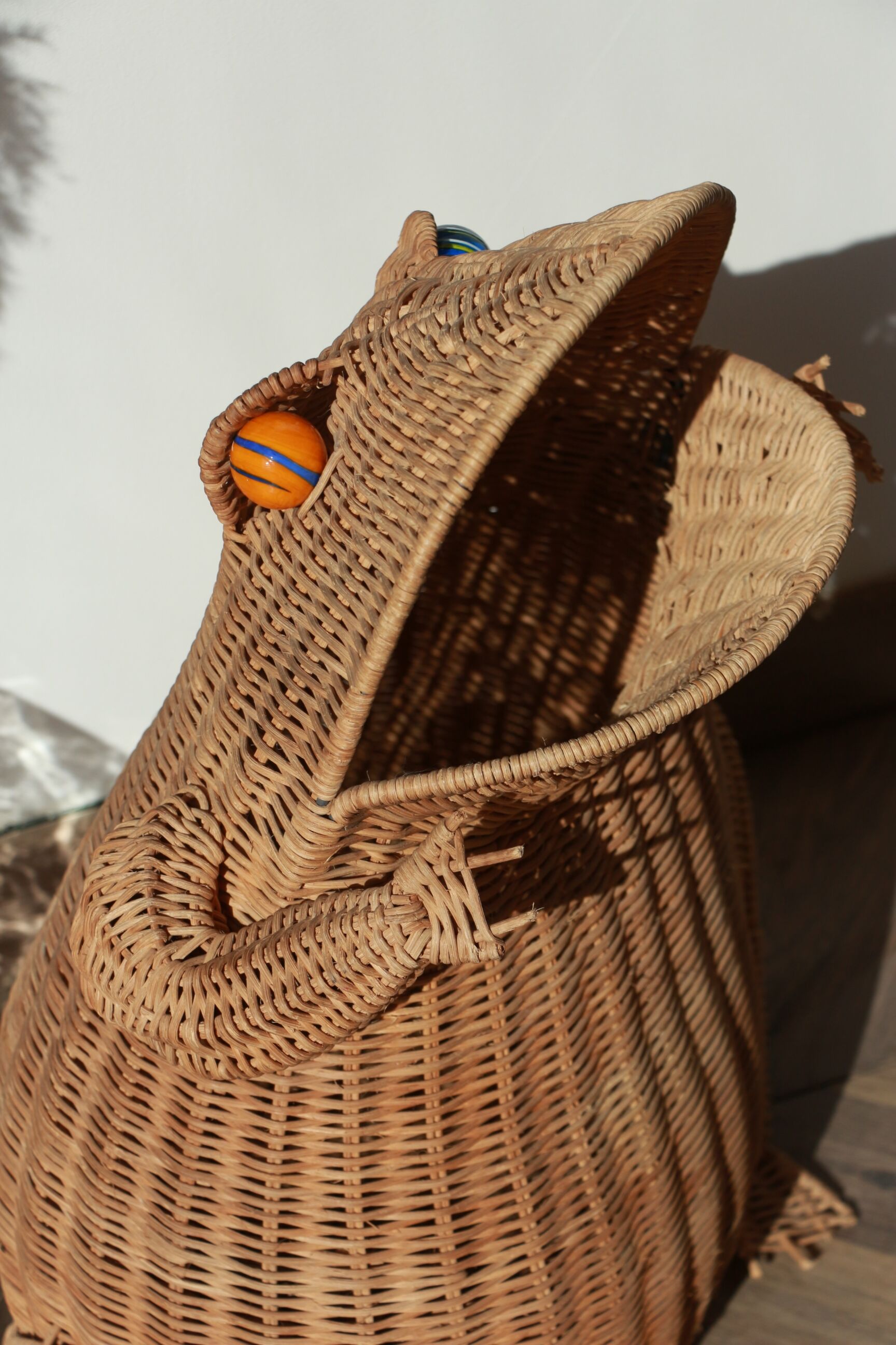 Wicker frog magazine rack by Olivier Cajan