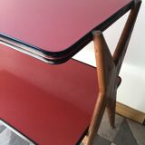 Double-footed red Formica wood spindles console