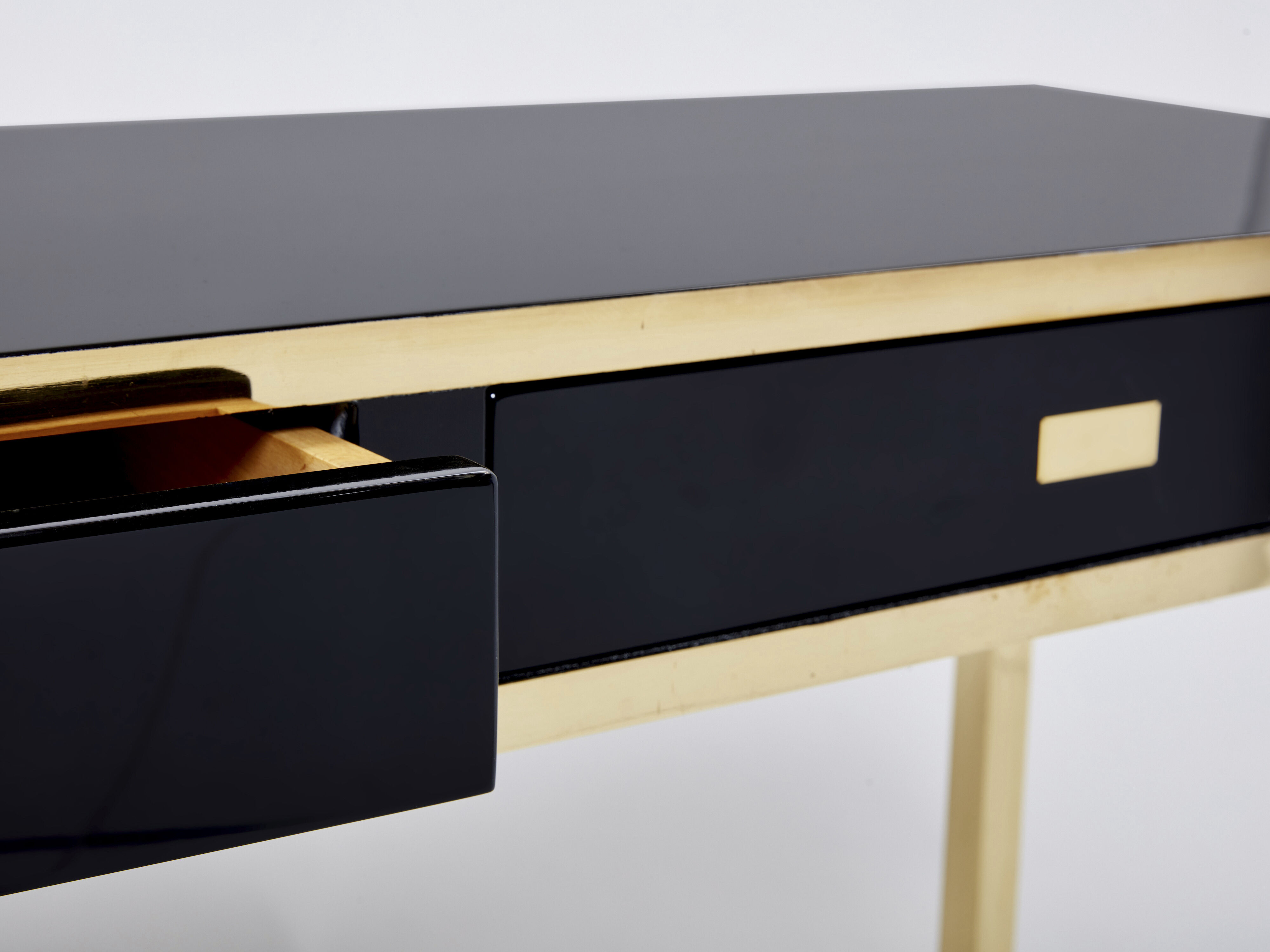 Pair of black lacquered consoles and brass 1970