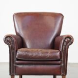 Sheep leather armchair correctly finished with decorative nails