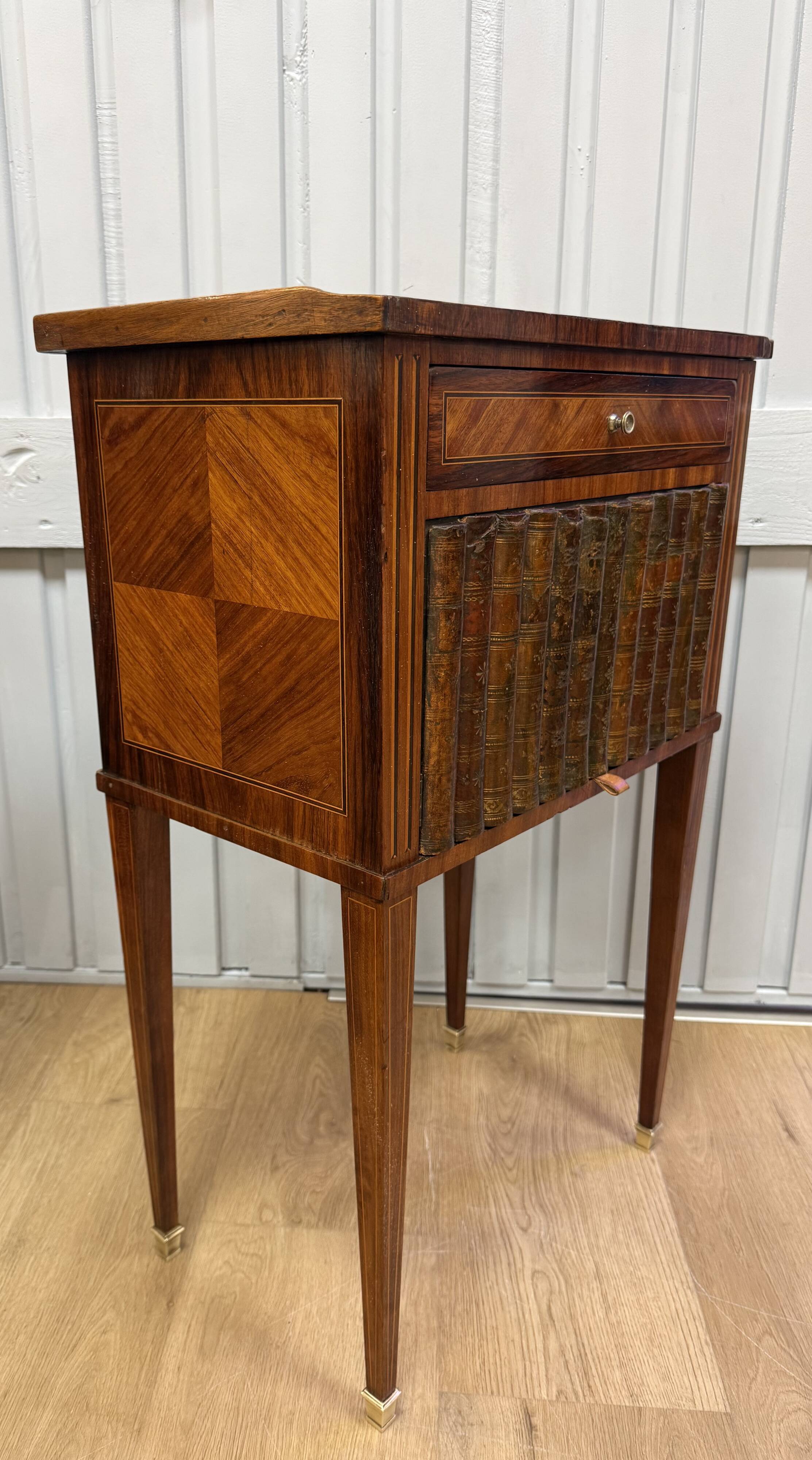 Side table with a faux book front.