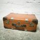 The cardboard suitcase