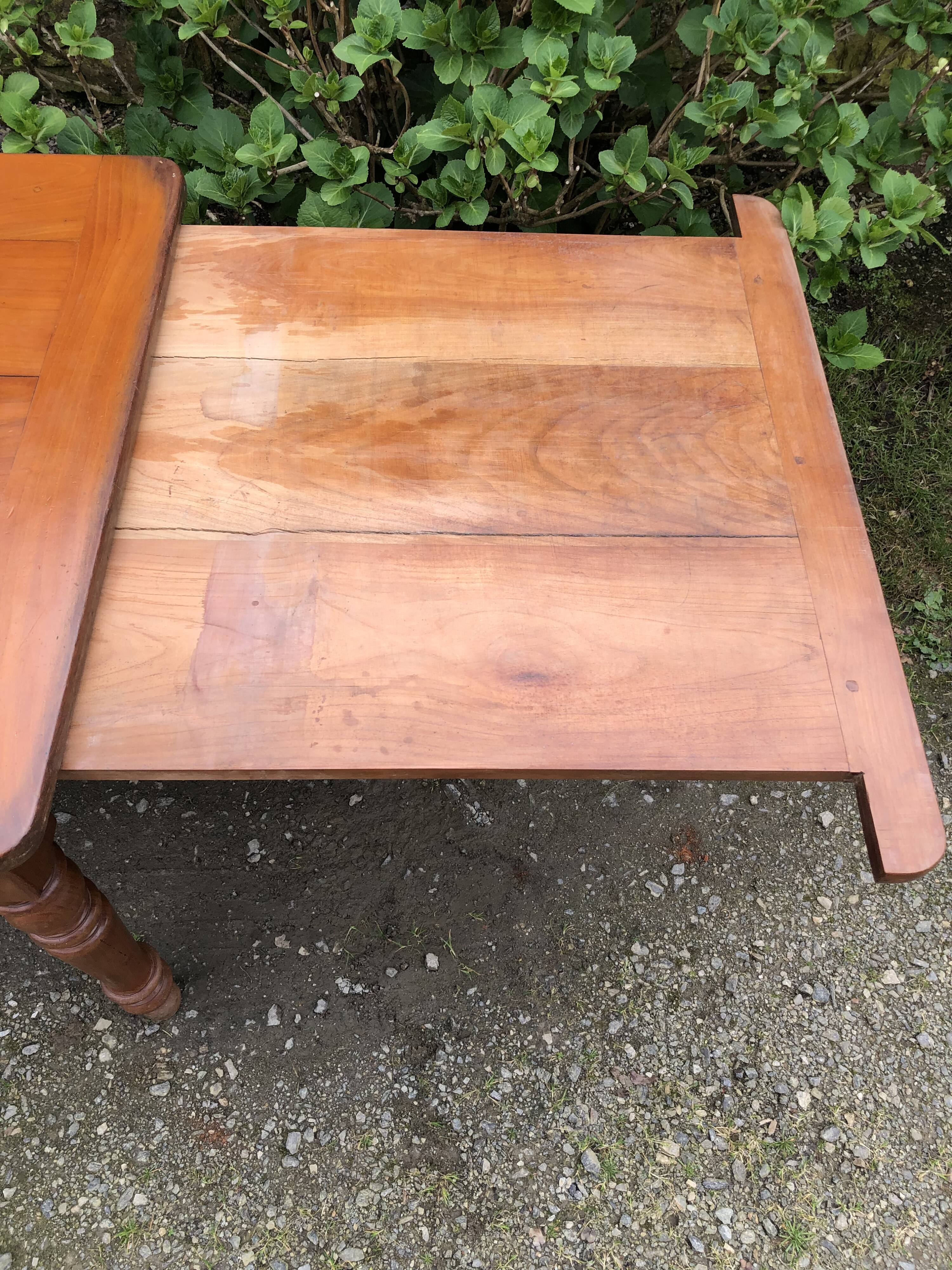 Antique Louis Philippe style farmhouse table in solid cherry wood with its 2 extensions.