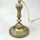 Antique brass foot lamp with glass globe and diamond point.