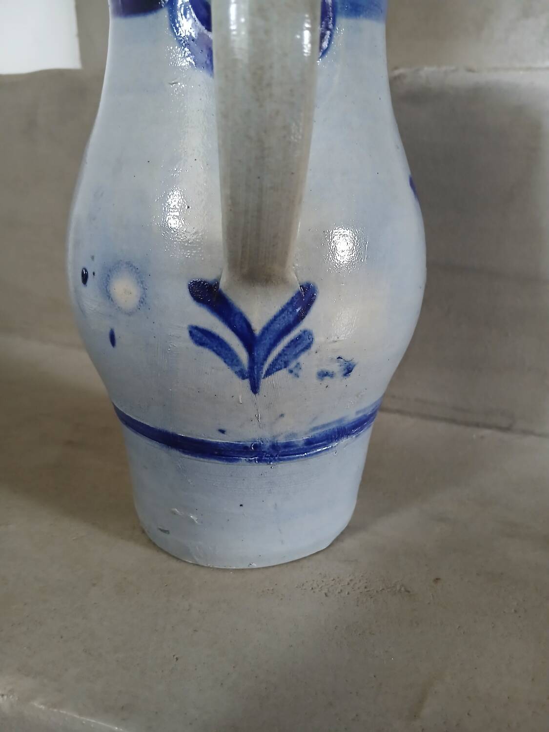 2 antique stoneware pitchers