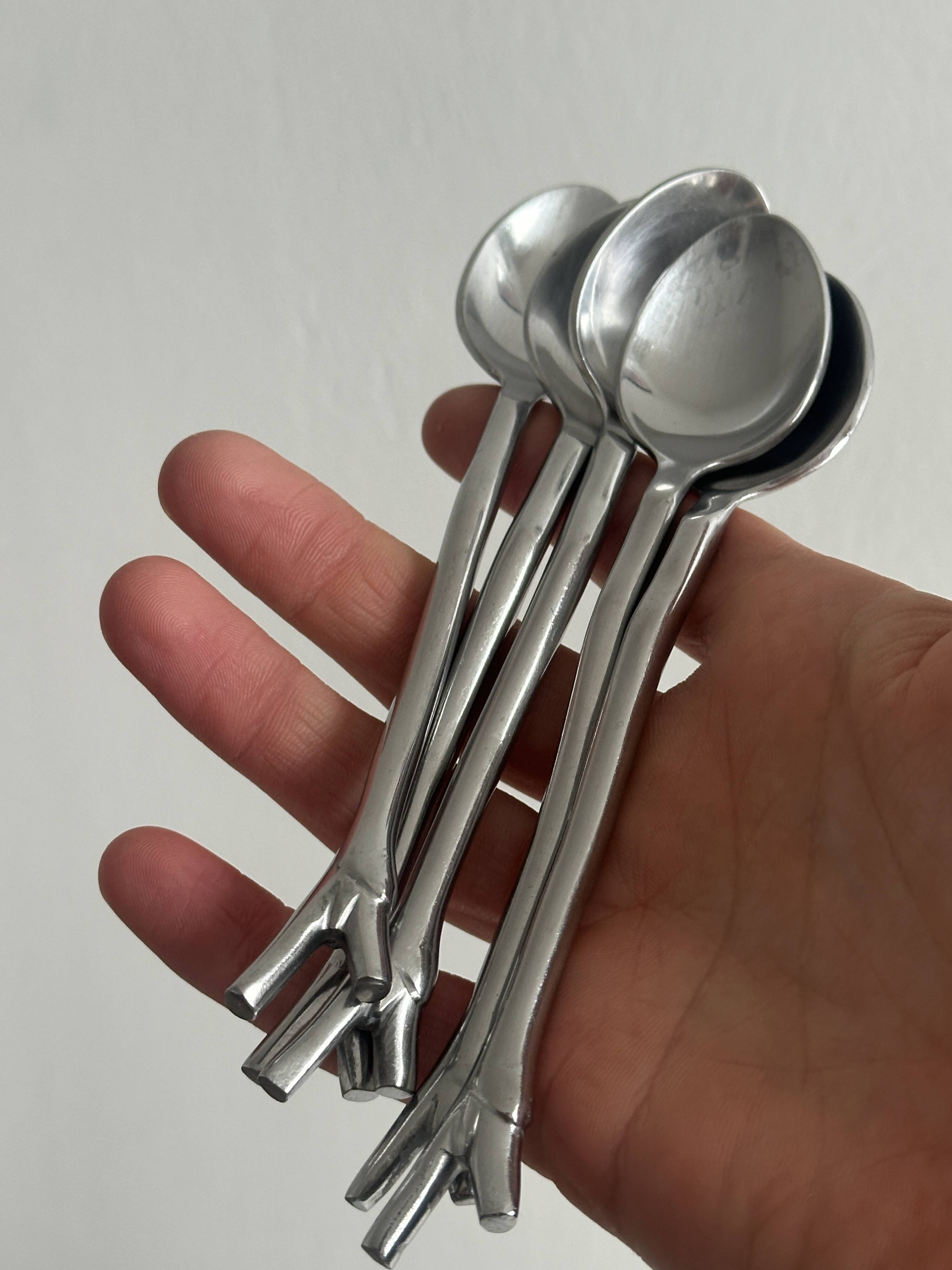 5 small silver metal spoons