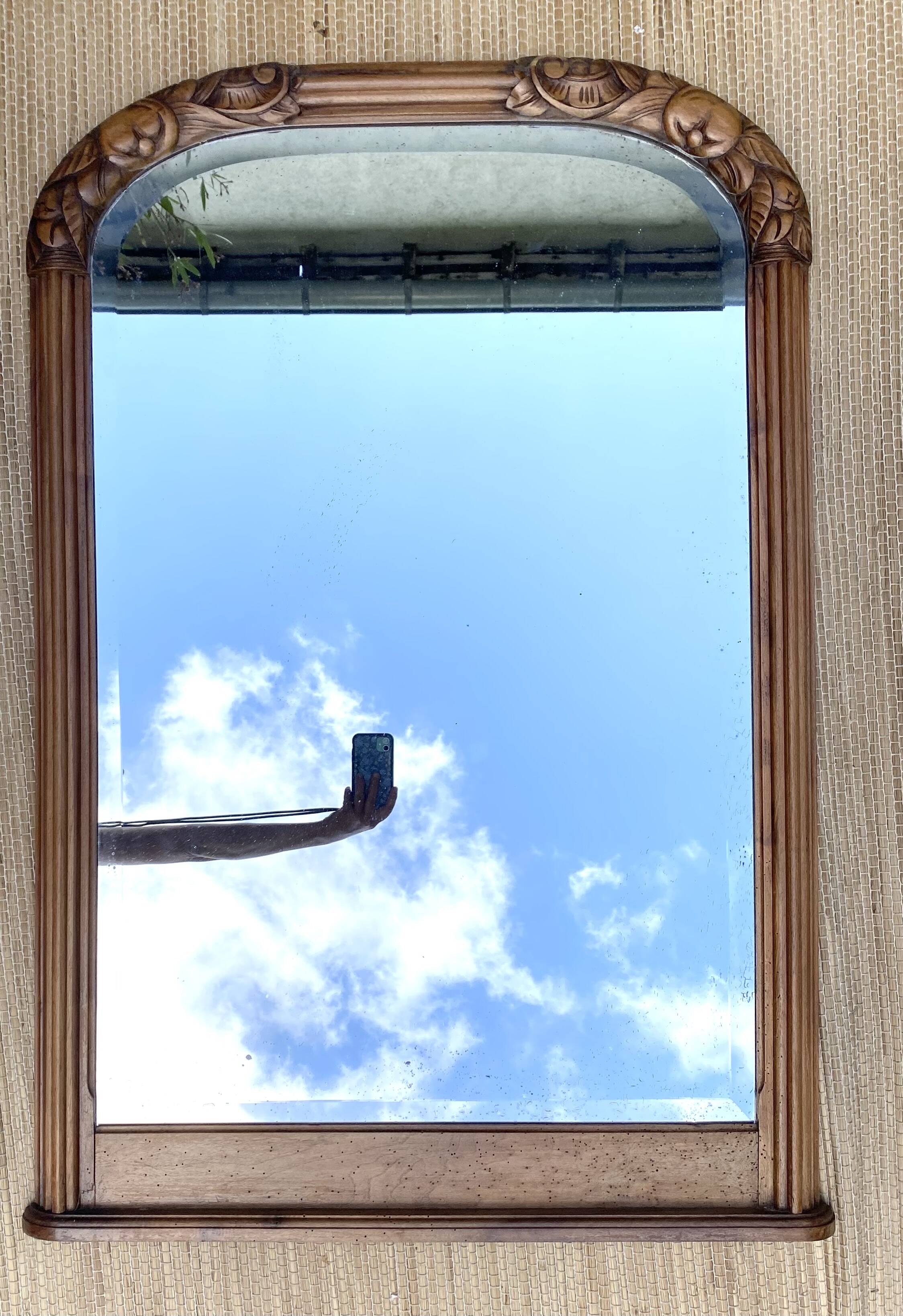 Beveled art deco mirror, carved wood