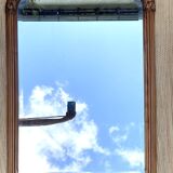 Beveled art deco mirror, carved wood