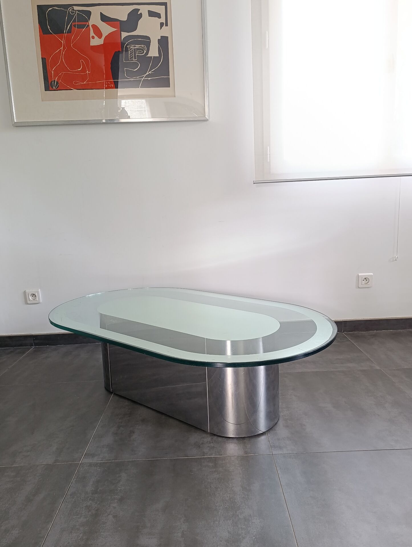 Vintage coffee table with glass and chrome metal.