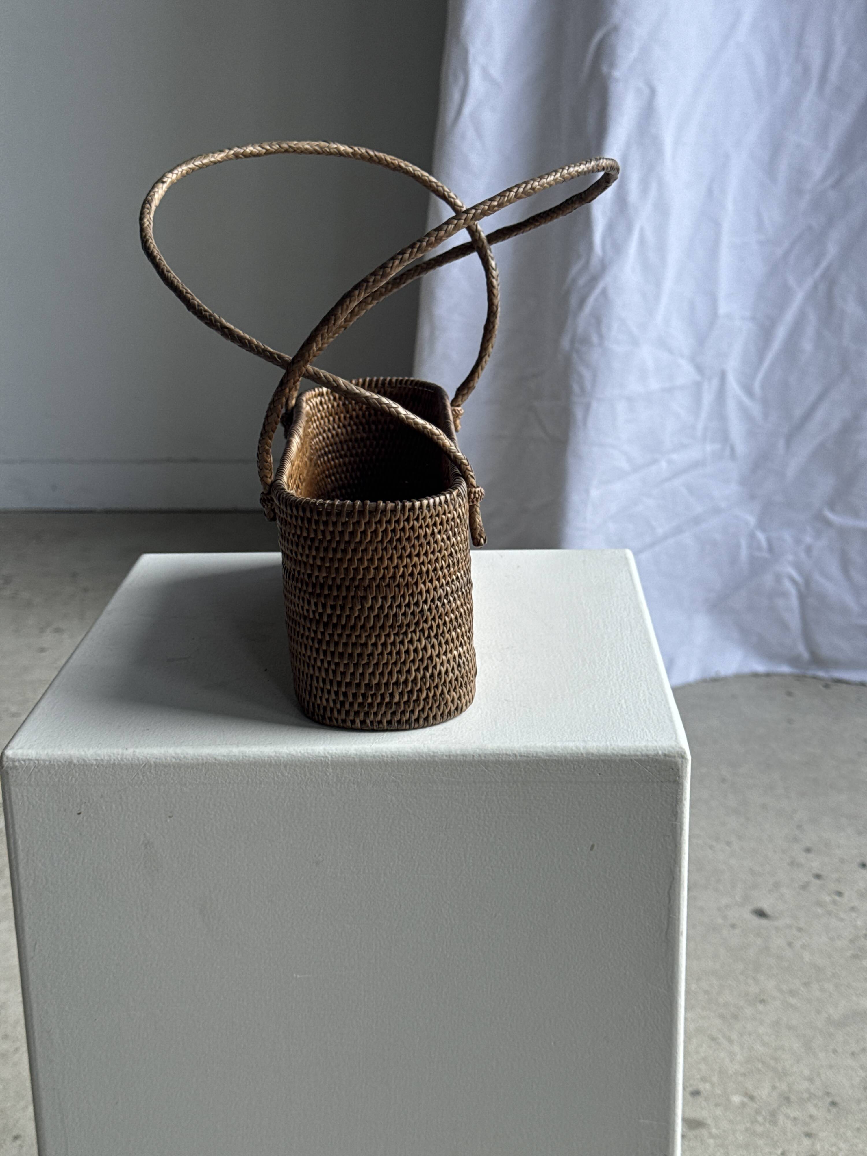 Small oval basket with long handles, traditional Indonesian L28xH10