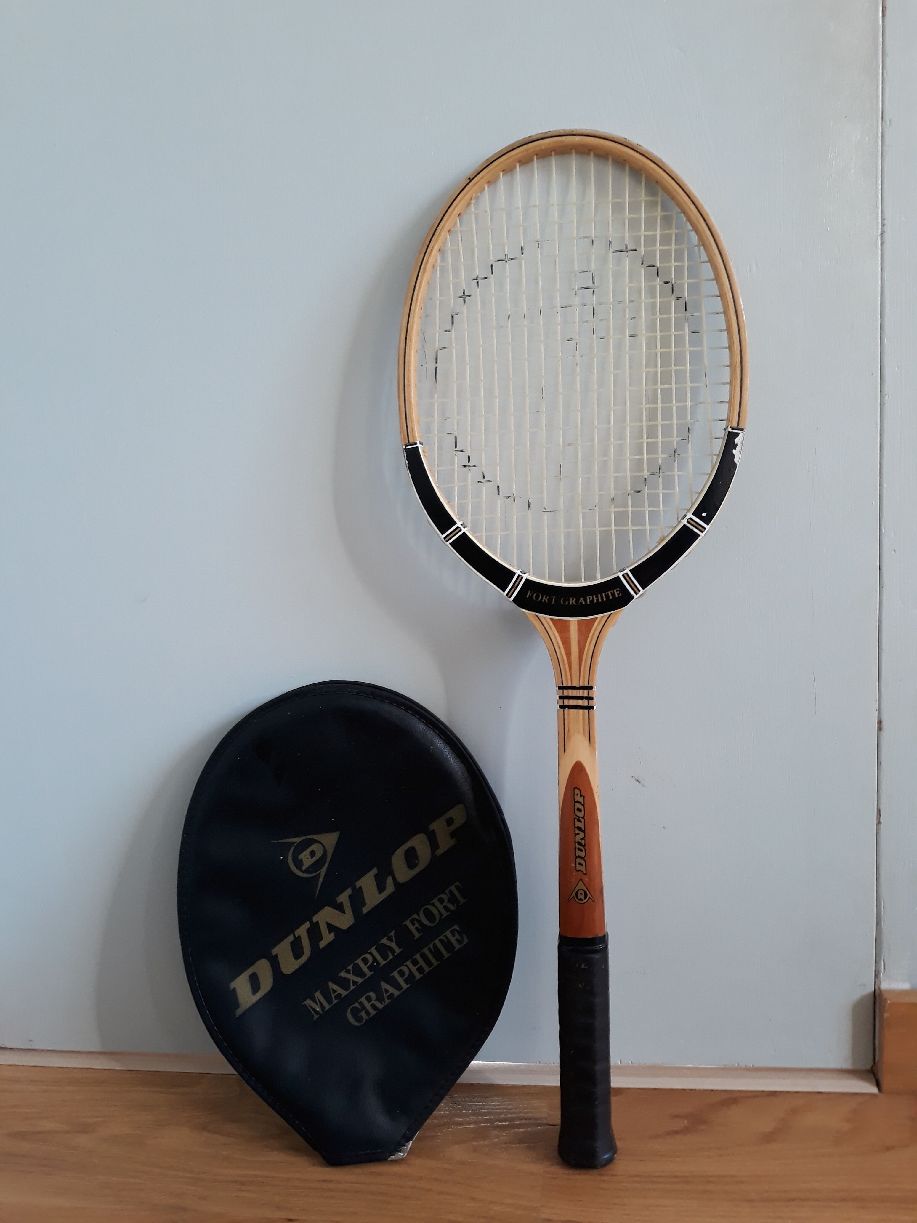 Wooden Dunlop tennis racket with its cover