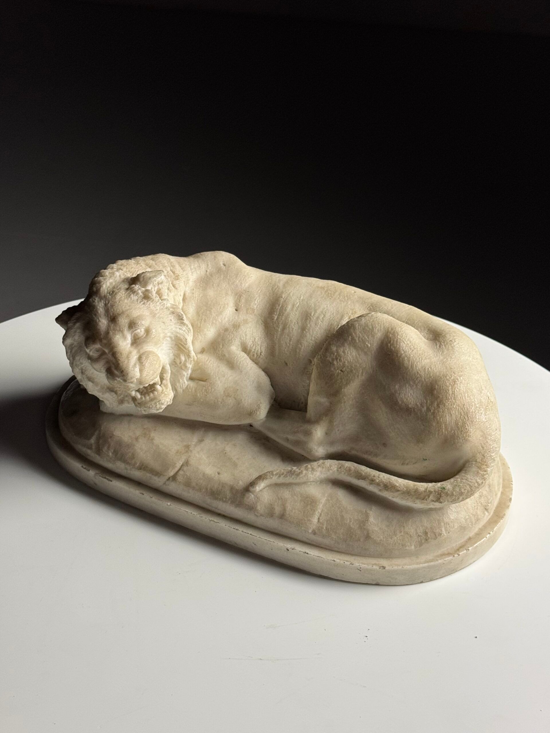 Marble sculpture of a reclining lion