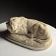 Marble sculpture of a reclining lion