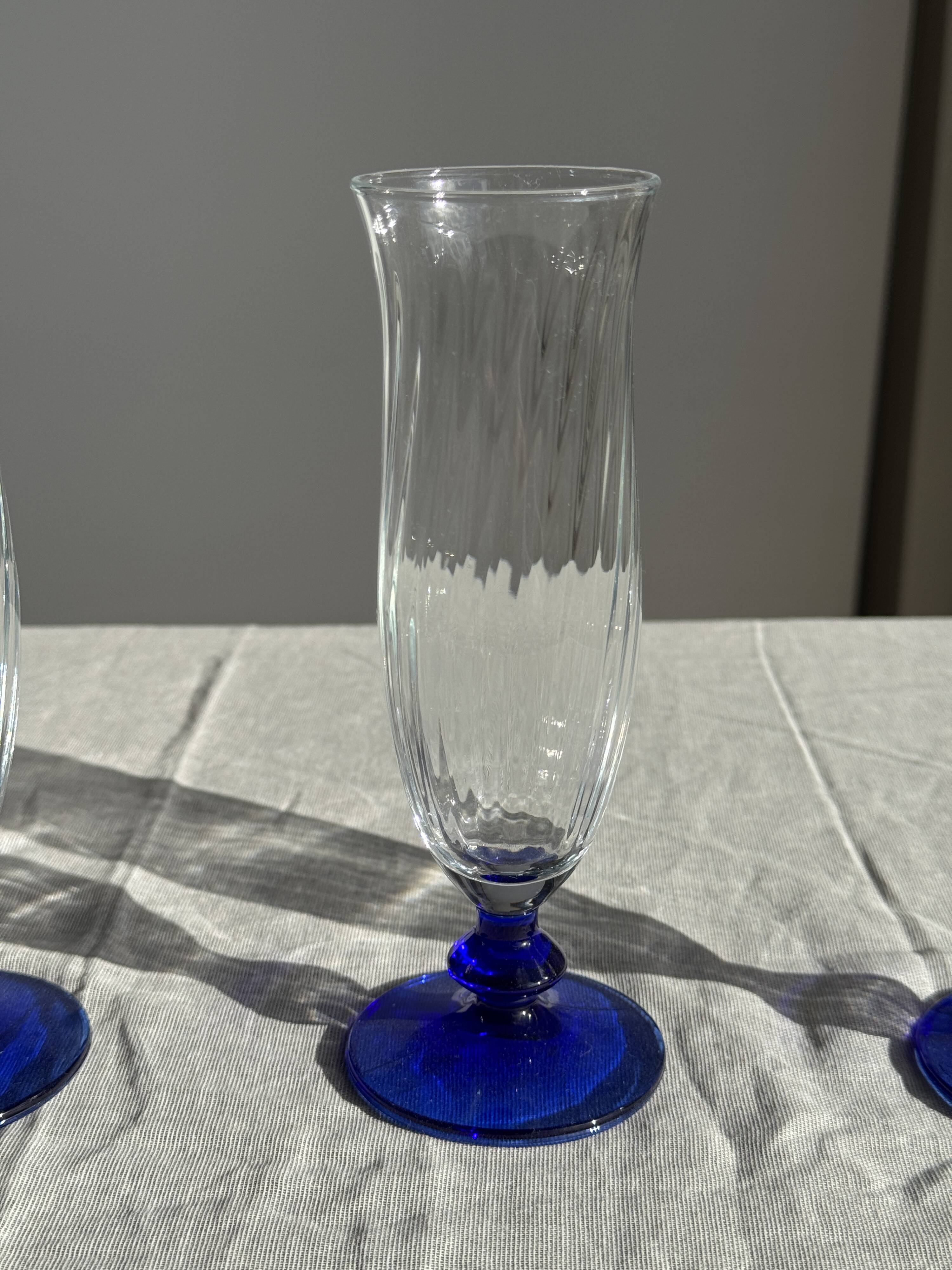 Set of 6 blue-footed champagne flutes; 3 pairs of designs.