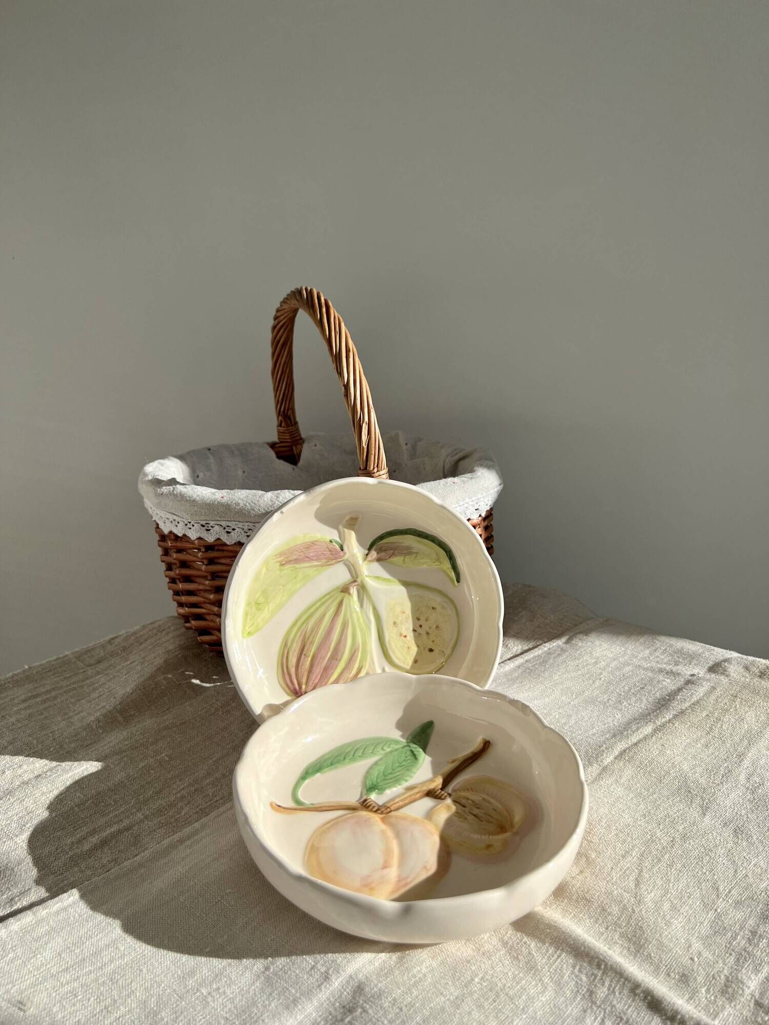 Pair of vintage hollow dessert plates in hand-painted slip, peach and fig fruit pattern