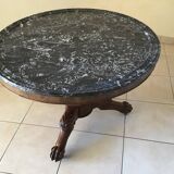 Wooden gueridon with marble, lion paw legs.