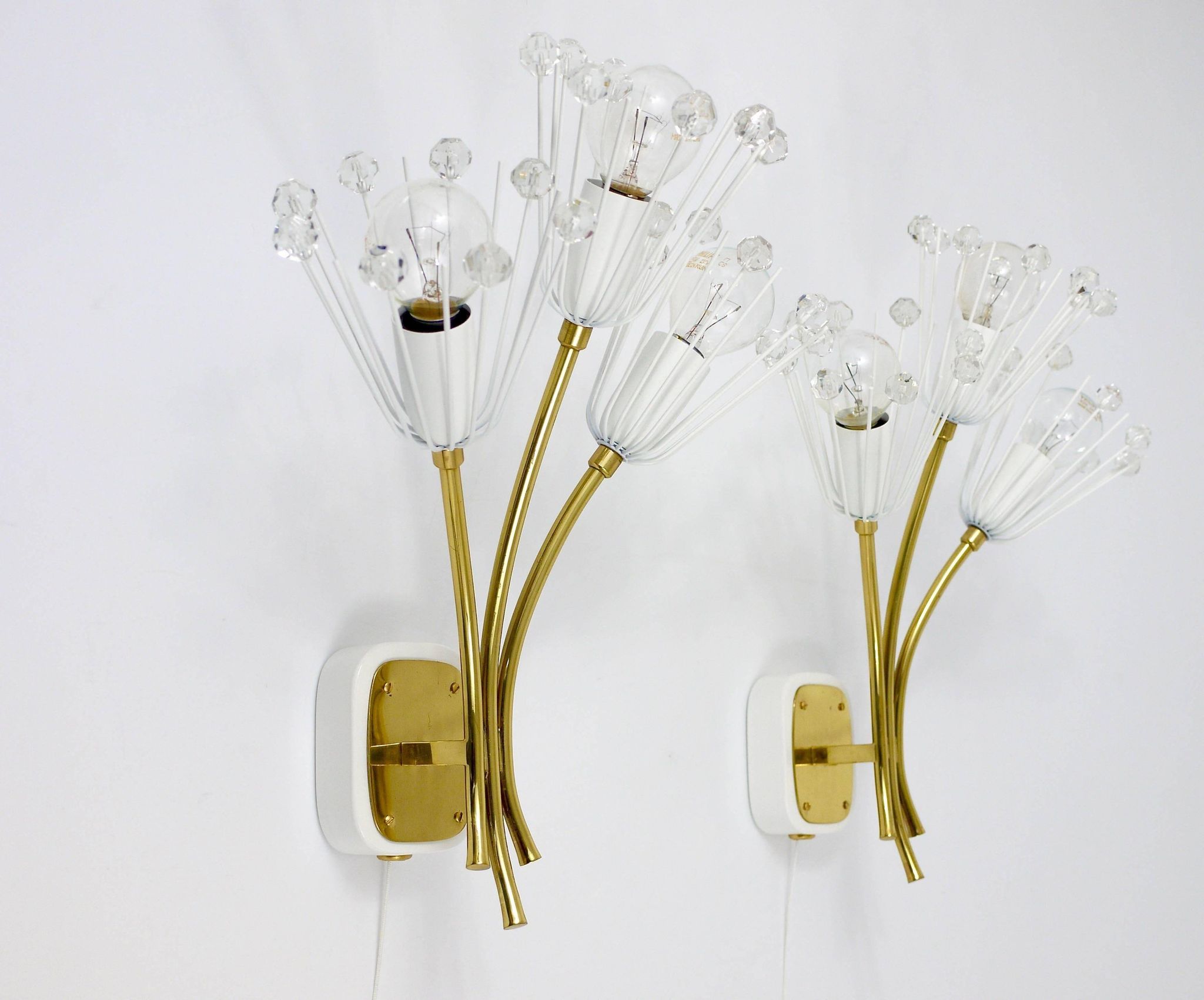 Pair of mid-century wall sconces in brass with flowers, Emil Stejnar, Rupert Nikoll, Austria, 1950s.
