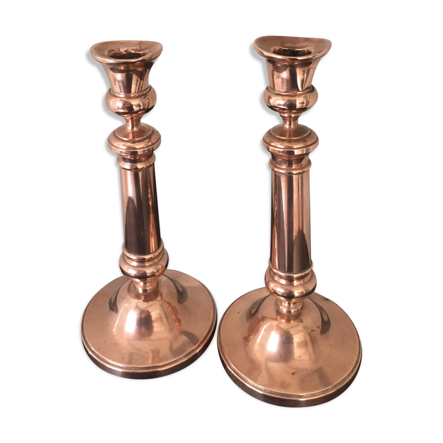 Pair of pink copper candlesticks