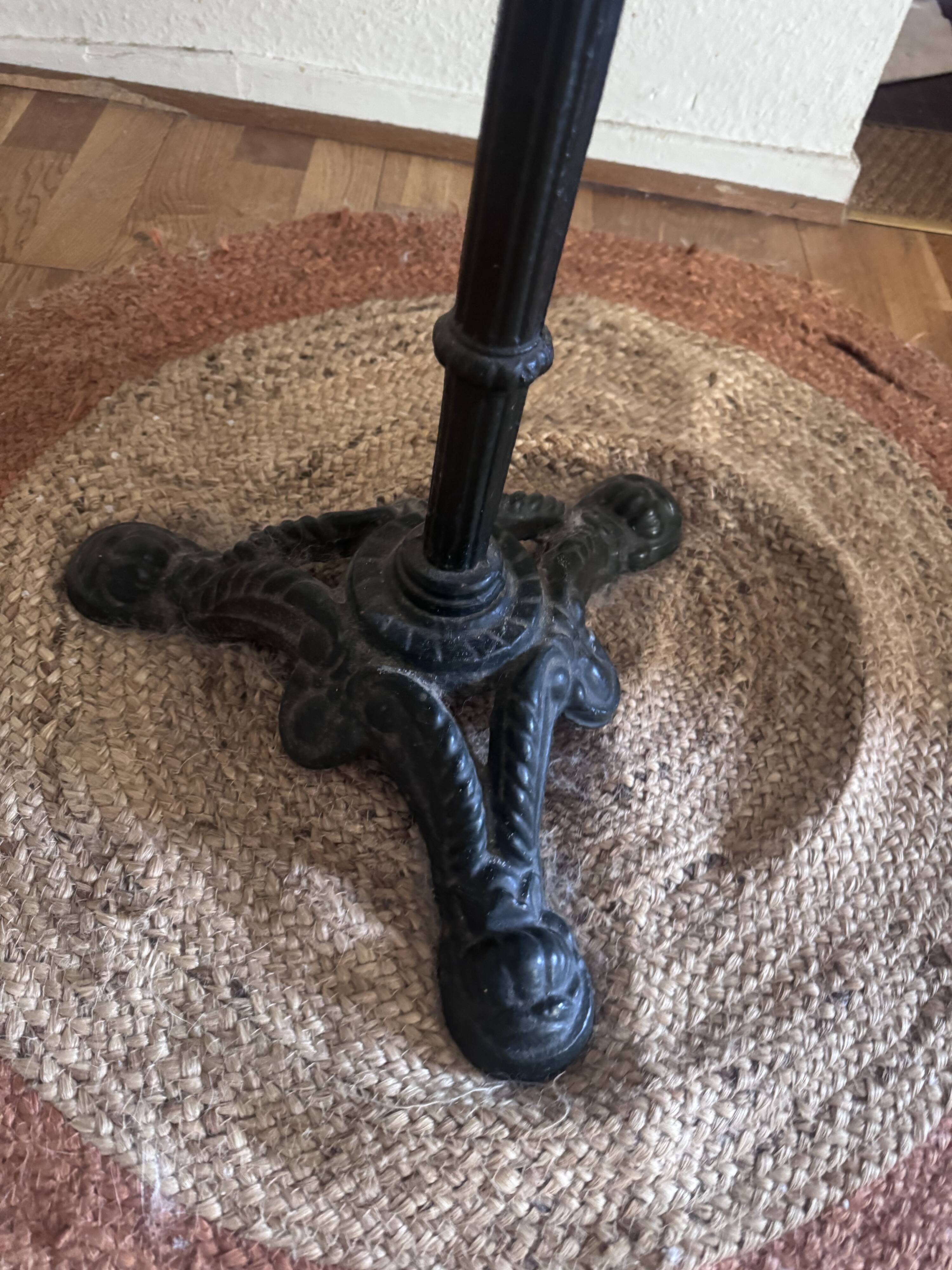 Marble side table with a cast iron base.