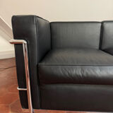 For sale: designer two-seater sofa.