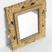 Decorative gold mirror mid-century in a wooden frame, Italy, 1960s.