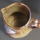 Glazed terracotta pitcher from the 20th century.